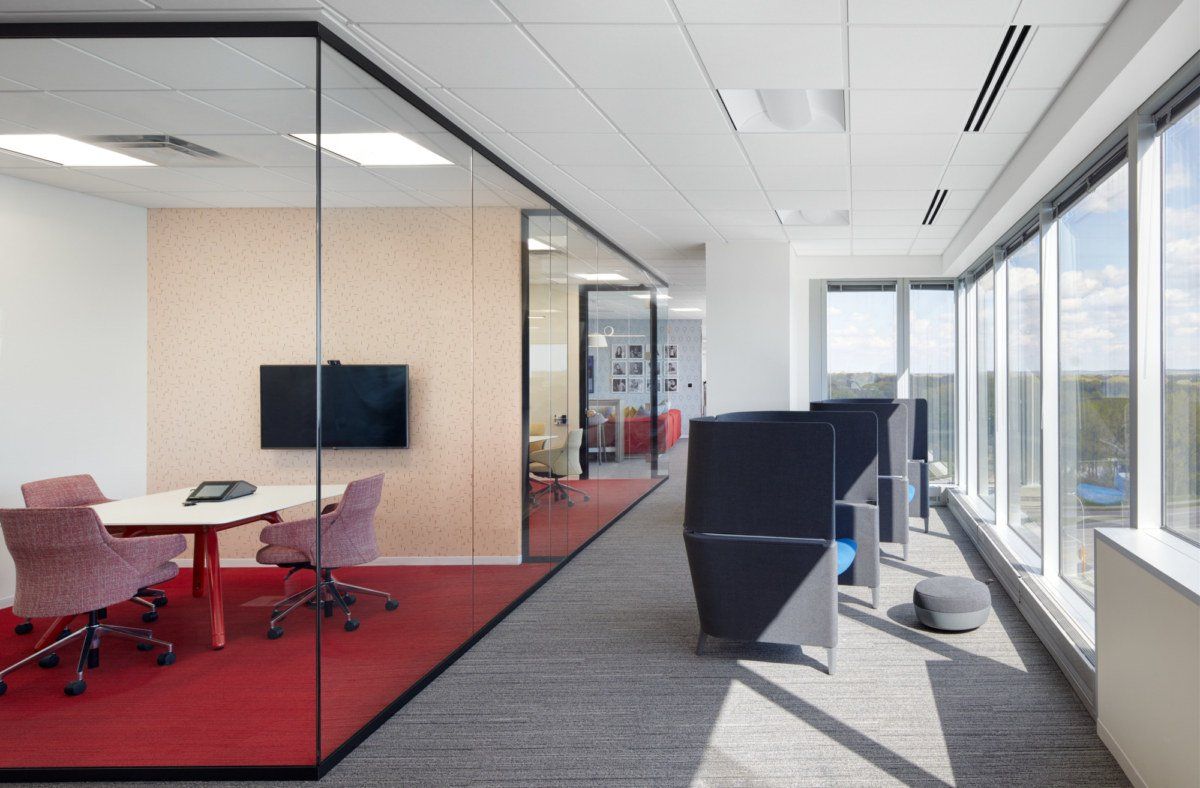 A conference room with a table and chairs in it
