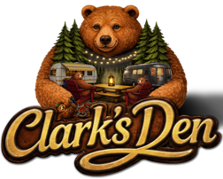 Clark’s Den RV Park logo with a brown bear, pine trees, and cabin lights
