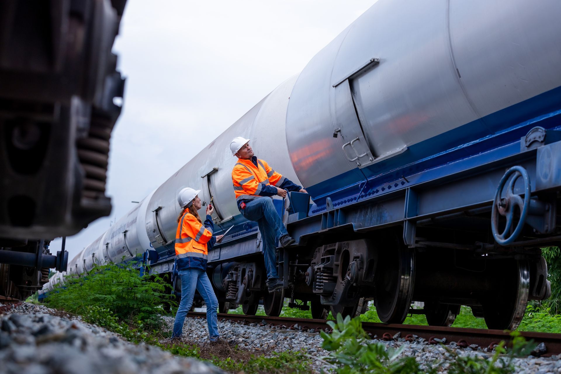 automotive workers doin inspection on train