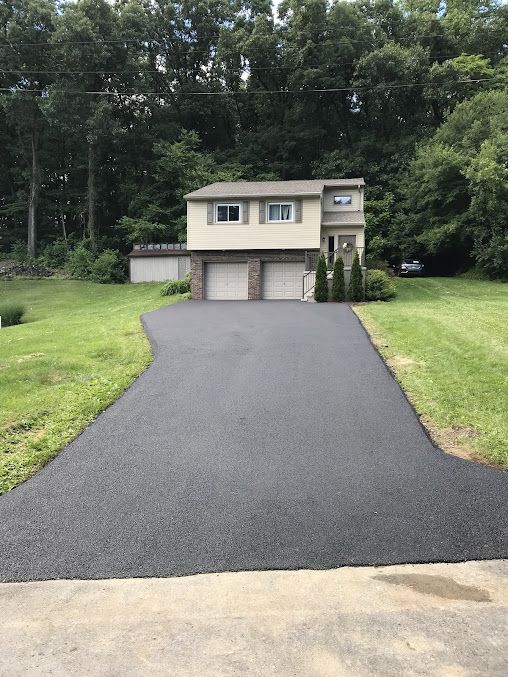 A Driveway Leading to a House with Two Garages — Kutztown, PA — B Young Paving