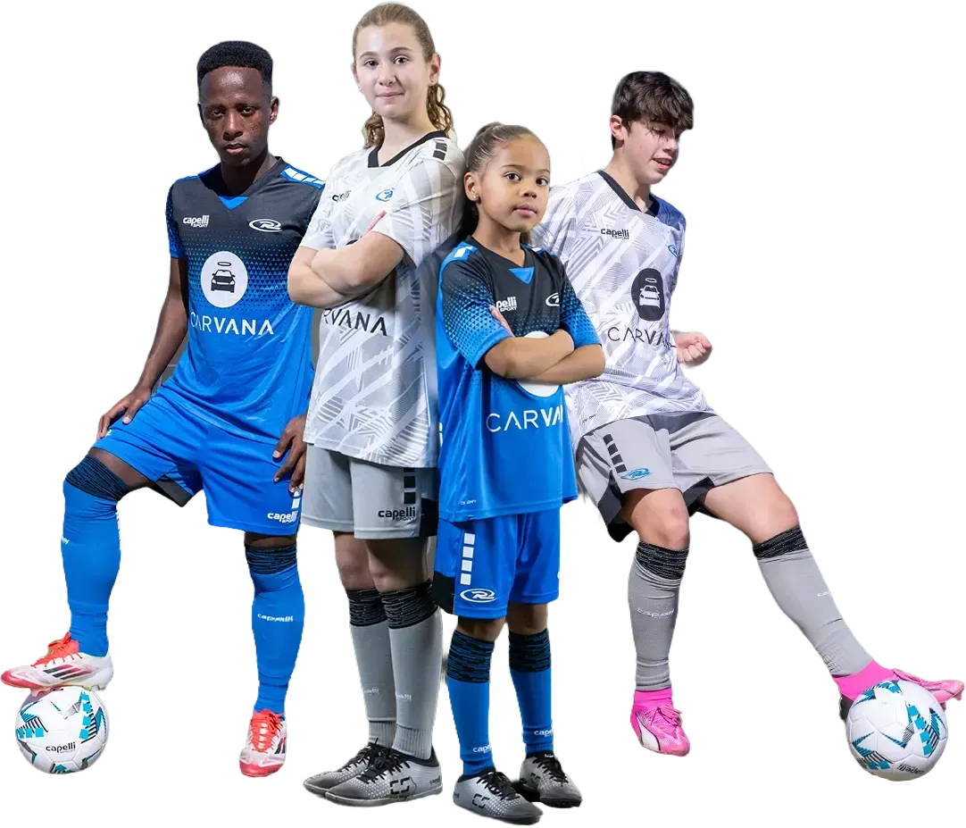Four soccer players in team uniforms pose with soccer balls.