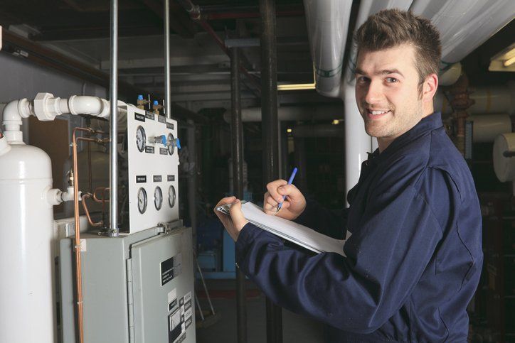 Woman Fixing Radiator — Greeley, CO — Advanced Mechanical Services