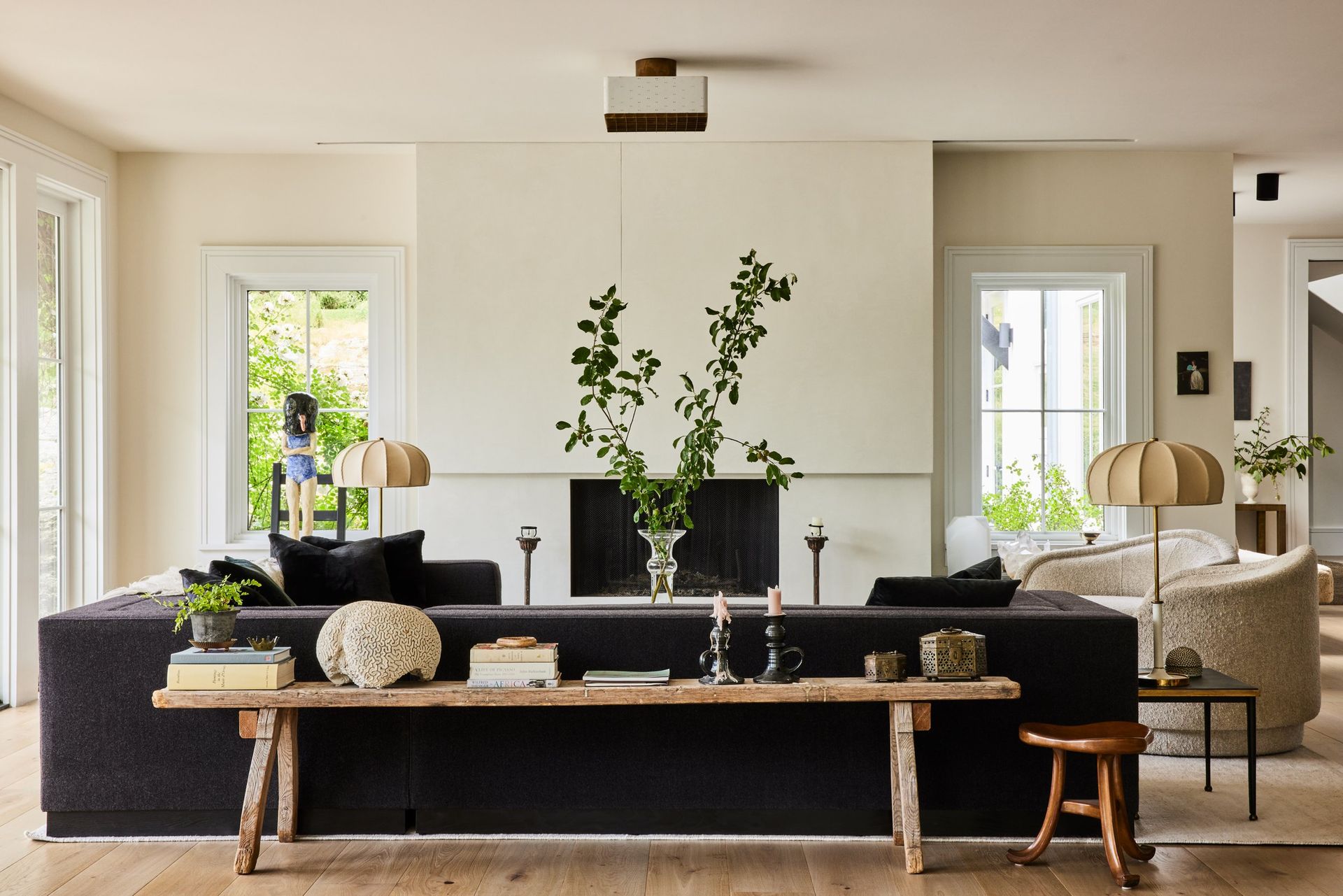 A living room with an elegant black couch. Buy a Home in Greenhaven-Pocket, Sacramento CA with Catricala Real Estate Group