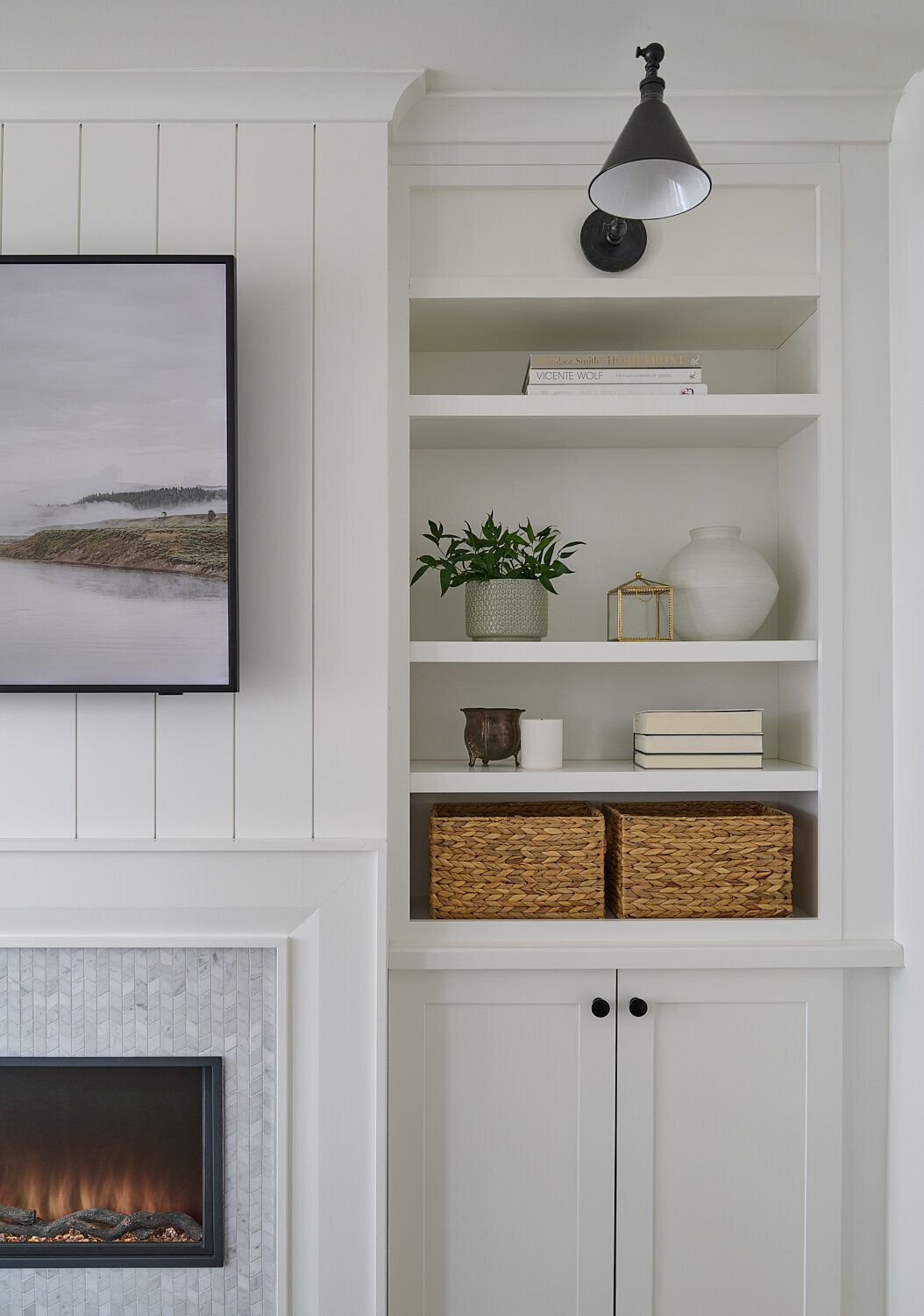A living room with a fireplace, shelves, and a flat-screen TV | Homes for Sale in Greenhaven-Pocket, Sacramento, CA