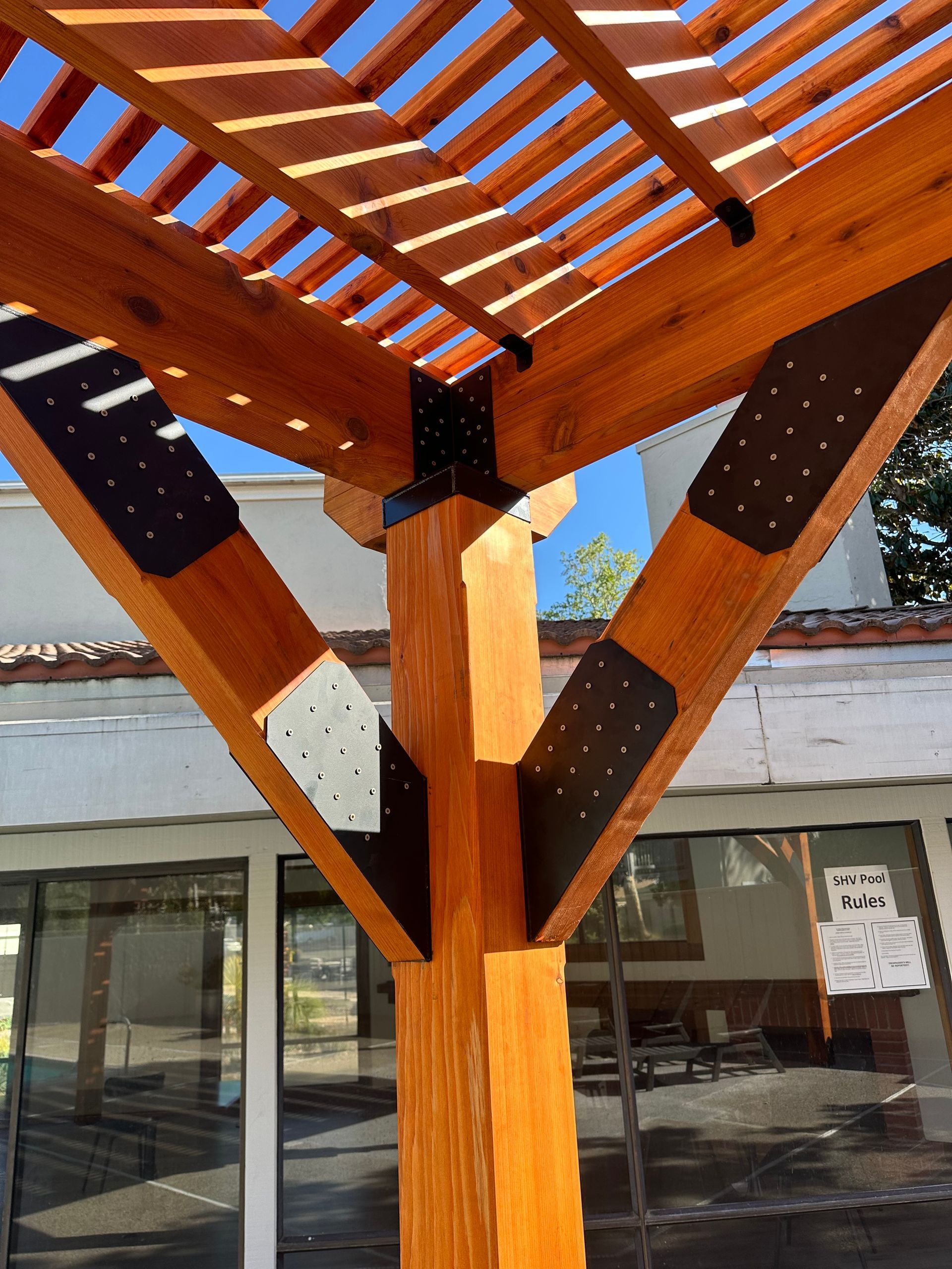 A close up of a wooden structure in front of a building