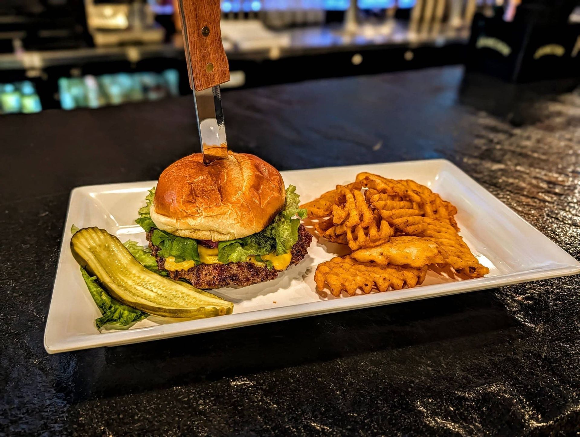 Burger with pickles and fries 