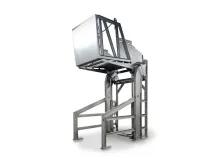 Industrial lift with a stainless steel bin tilted upward, in a white setting.