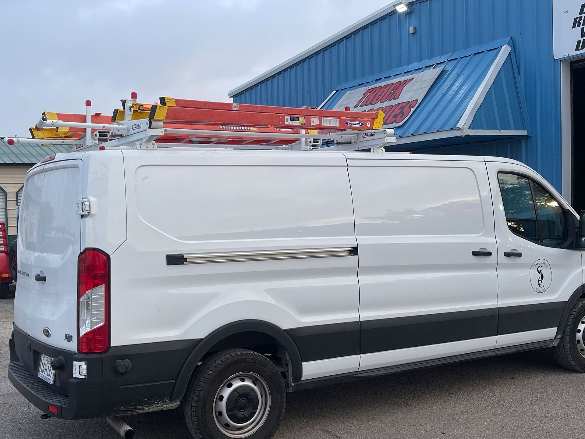 Modern cargo van near warehouse