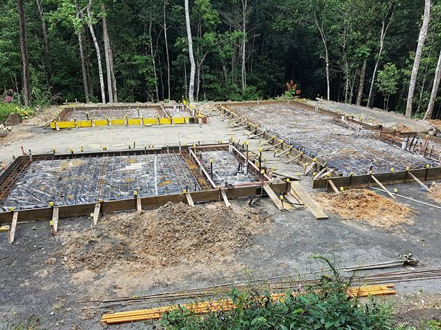 A Concrete Foundation Is Being Built In The Middle Of A Forest — B & C Donnachie Concrete Contractors in Kuranda, QLD