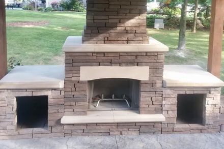 A Brick Fireplace On Top Of A Concrete Patio — Menasha, WI — Artscapes COC