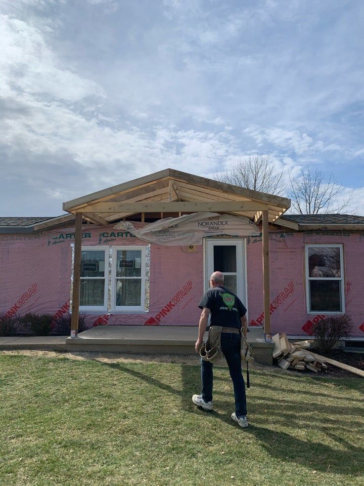 House with Man — Mansfield, OH — Zara Construction, Inc.