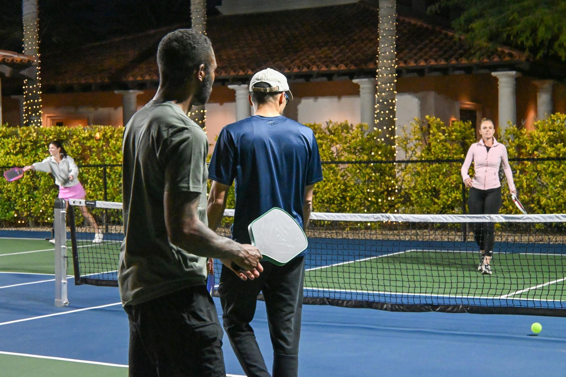 Two people playing pickleball