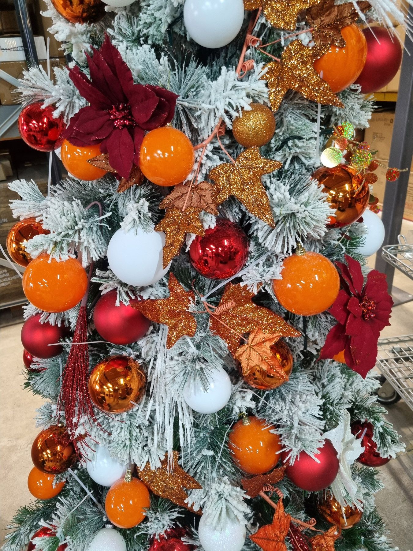 Bright orange and red decorated frosted garland
