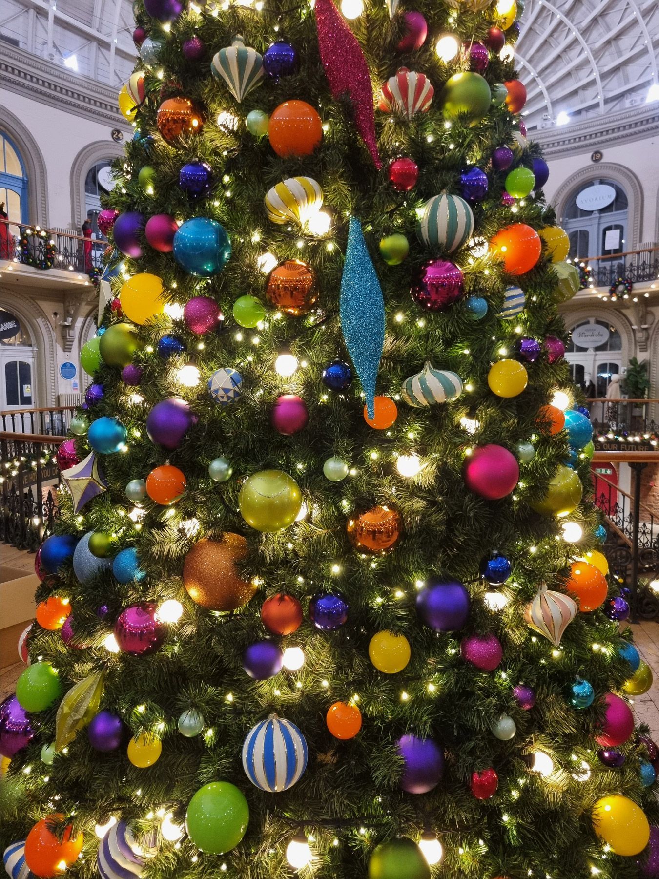 Large lit Christmas tree with colourful circus decorations