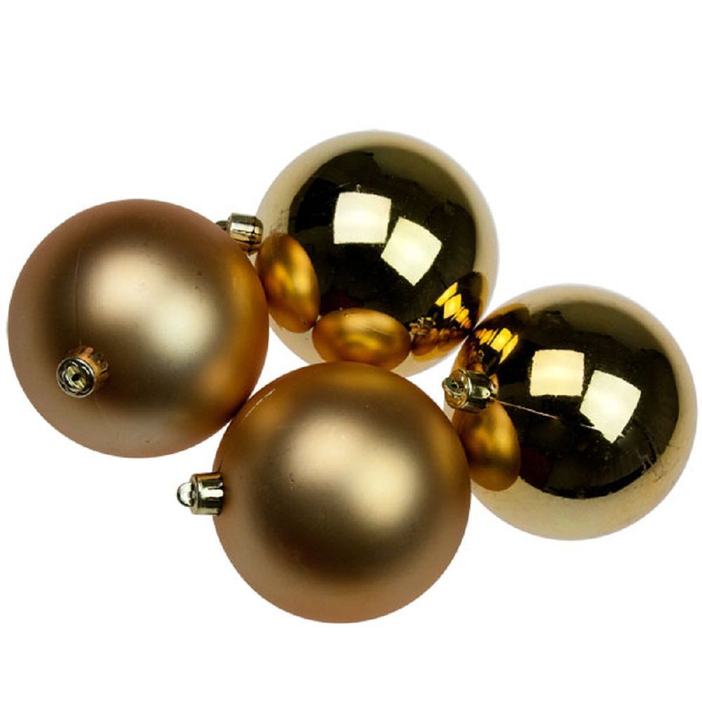 Gold and bronze Christmas ornaments clustered together on a white background
