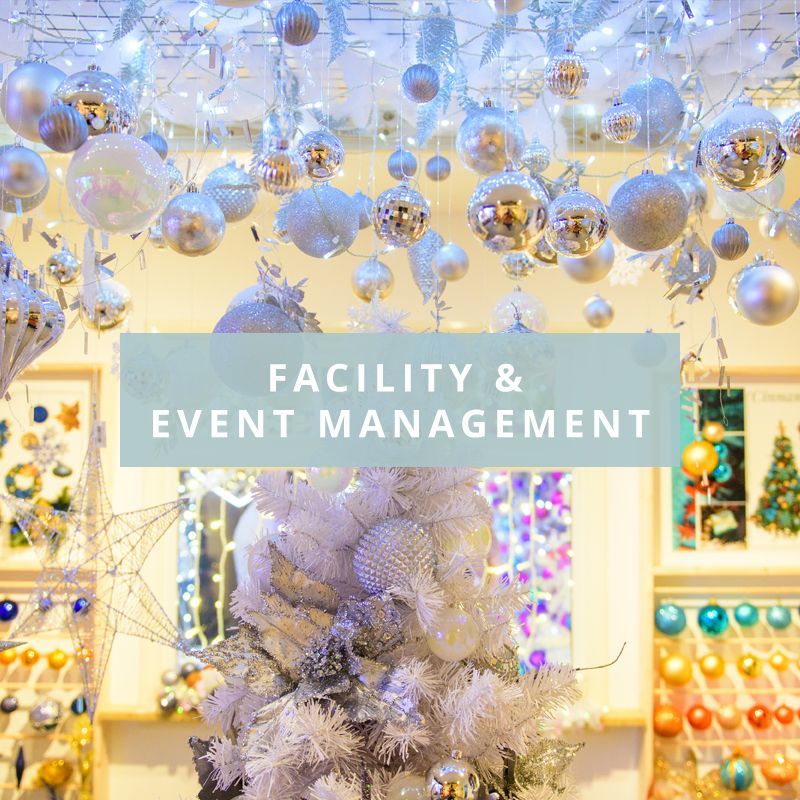A white christmas tree with facility & event management over the top.