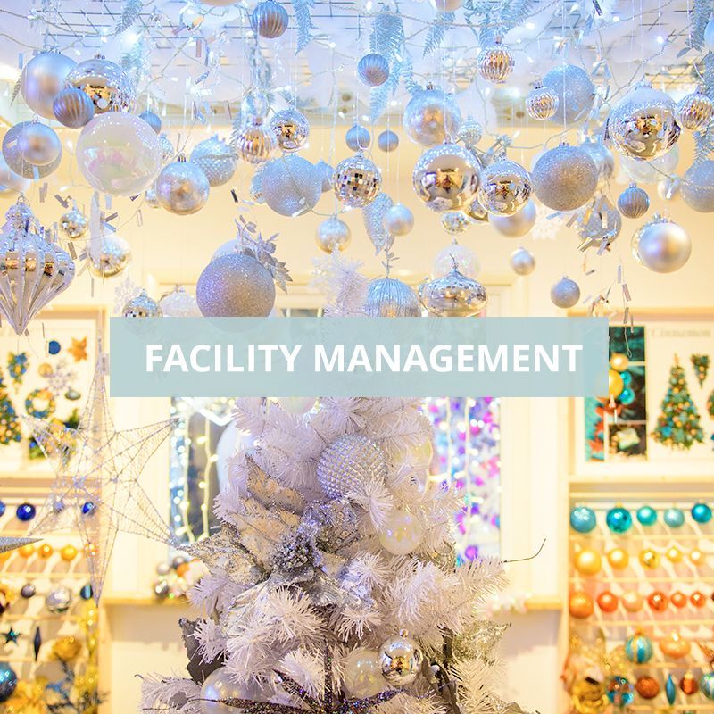 A white christmas tree with facility & event management over the top.