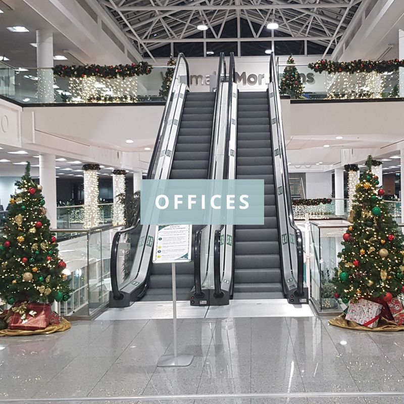 A text box that says offices in front of an escalator image.