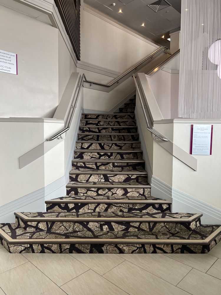 A set of stairs leading up to the second floor of a building