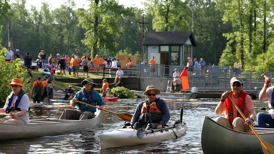 Paddlers in canoes and kayaks on the Dismal Swamp Canal