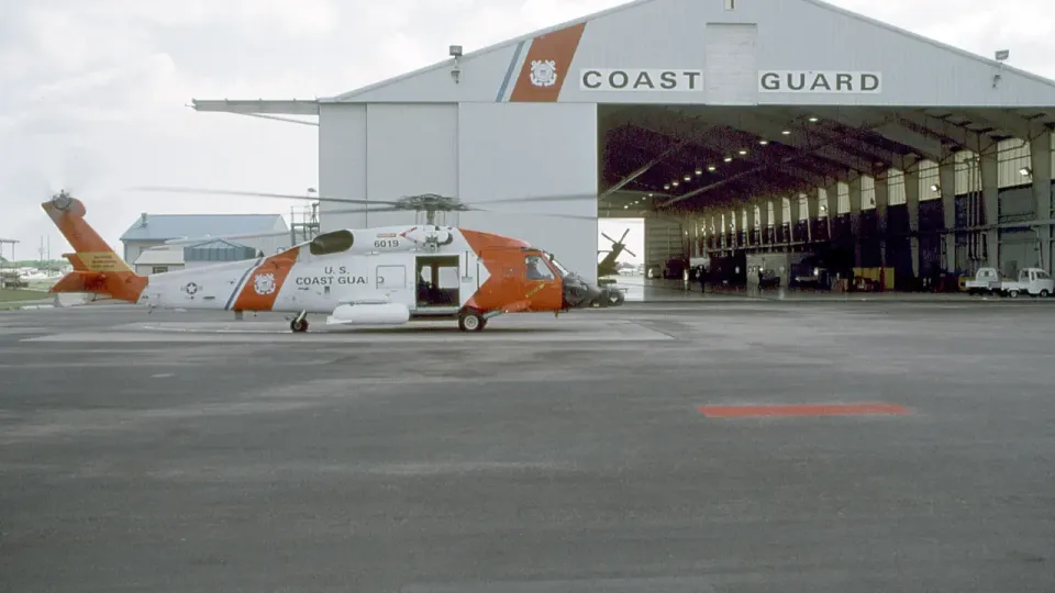 Coast Guard helicopter outside a hangar at Air Station Elizabeth City