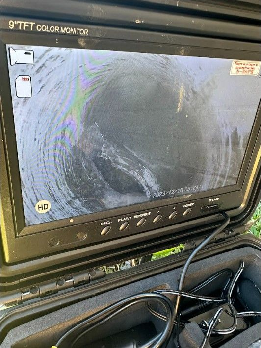 A 9 tft color monitor is sitting in a case.