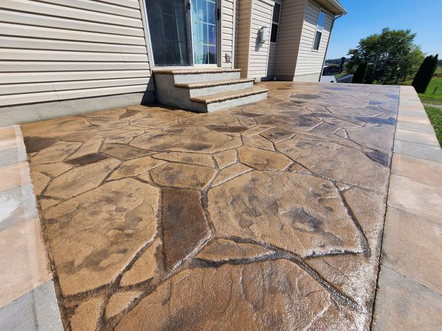 Stamped concrete patio completed by Migala Masonry & Design