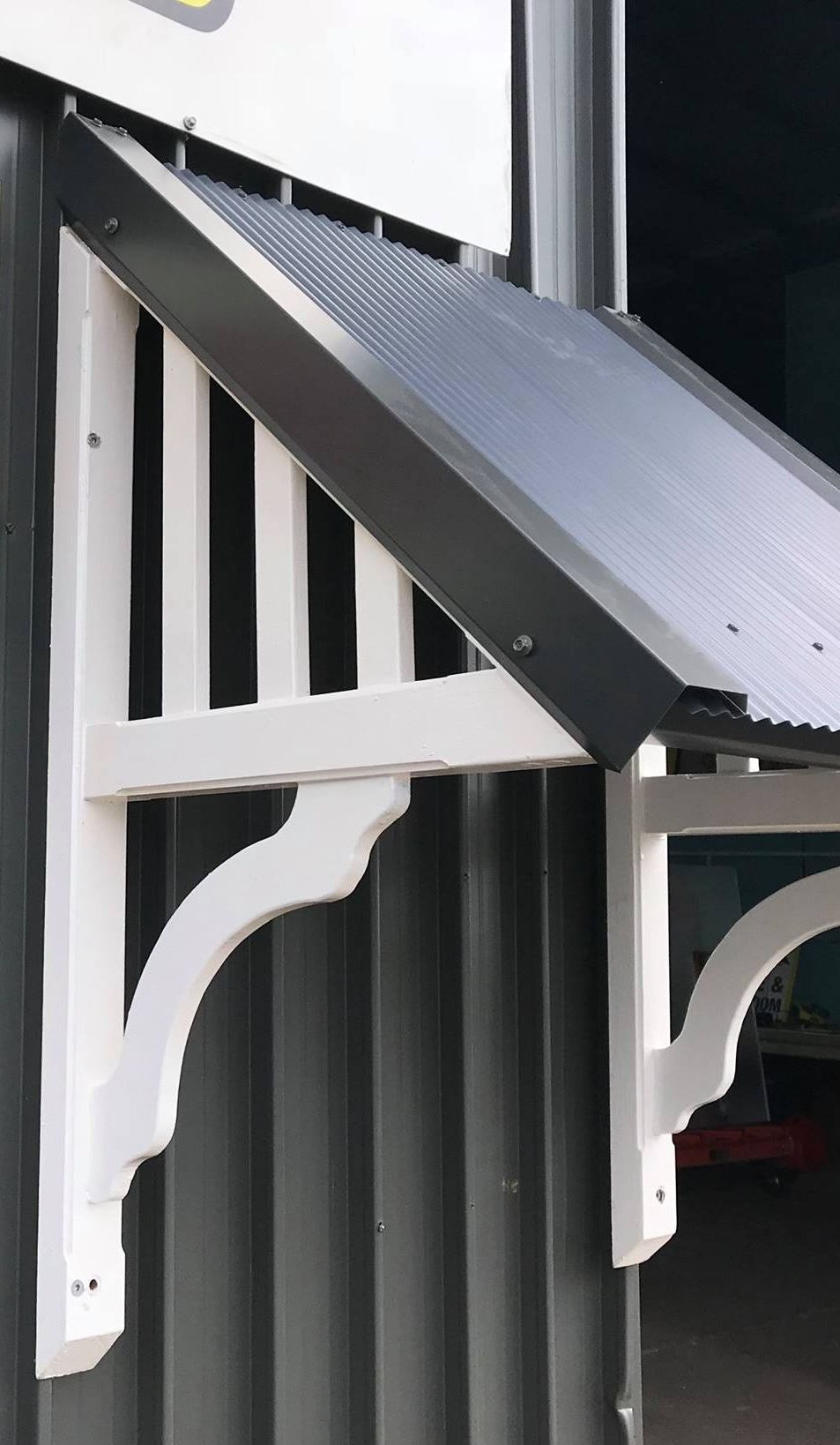 A white canopy is attached to the side of a building — Heritage Window Awnings in the Hunter Valley, NSW
