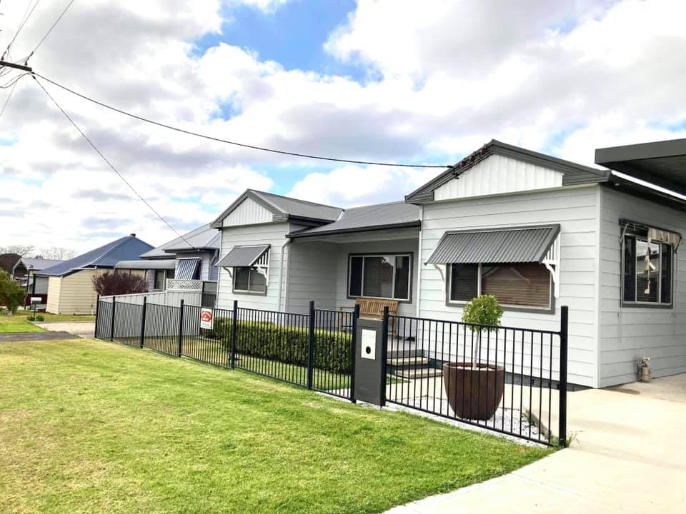 White And Gray Home Exterior — Heritage Window Awnings in Cessnock, NSW