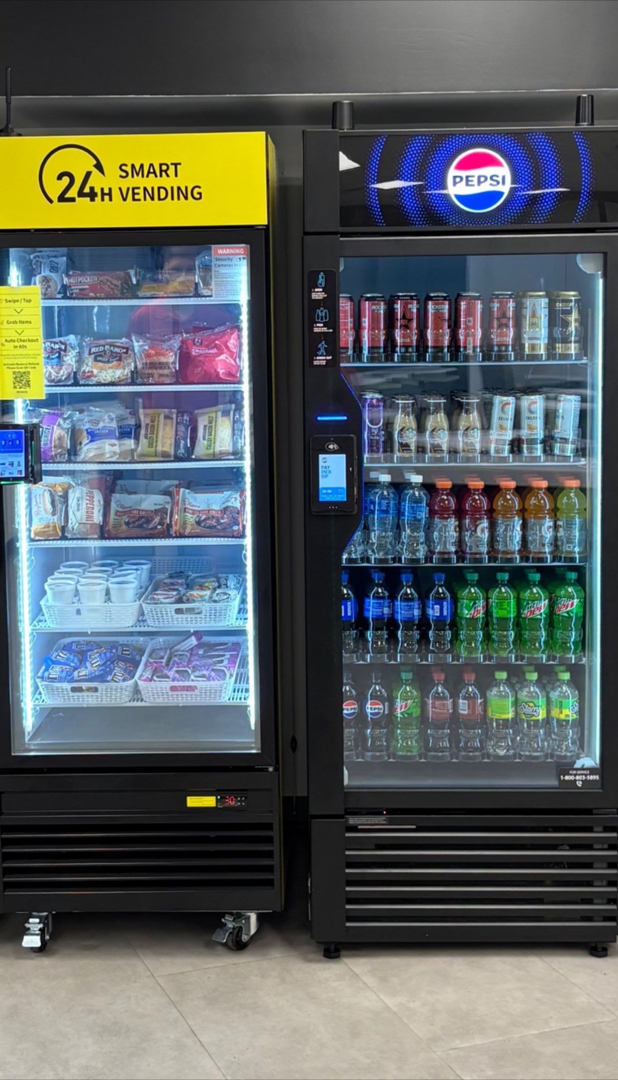 Two vending machines; one yellow-topped, one Pepsi-branded. Both have see-through doors showing snacks and drinks.
