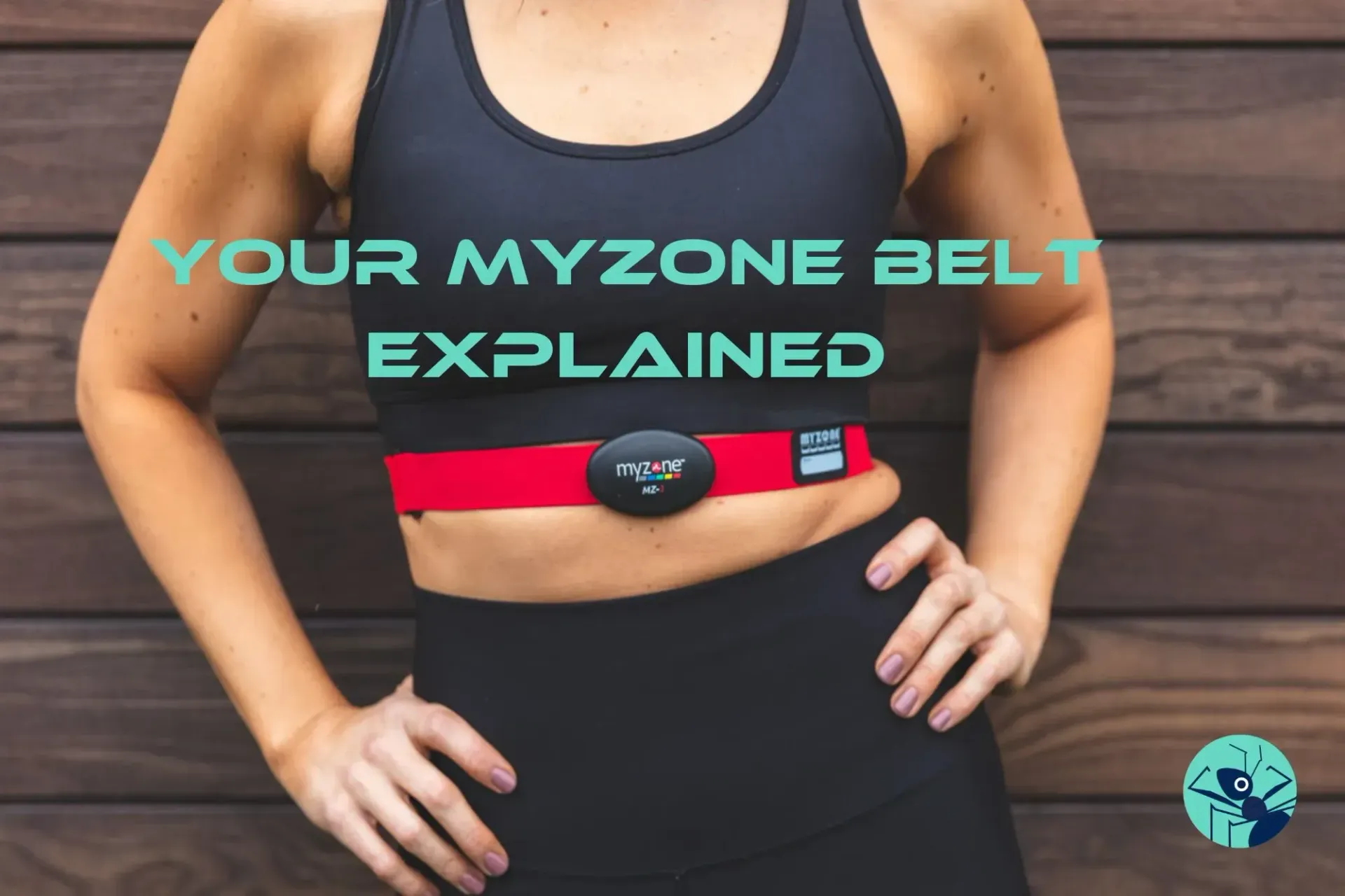 A woman wearing a myzone belt is standing with her hands on her hips