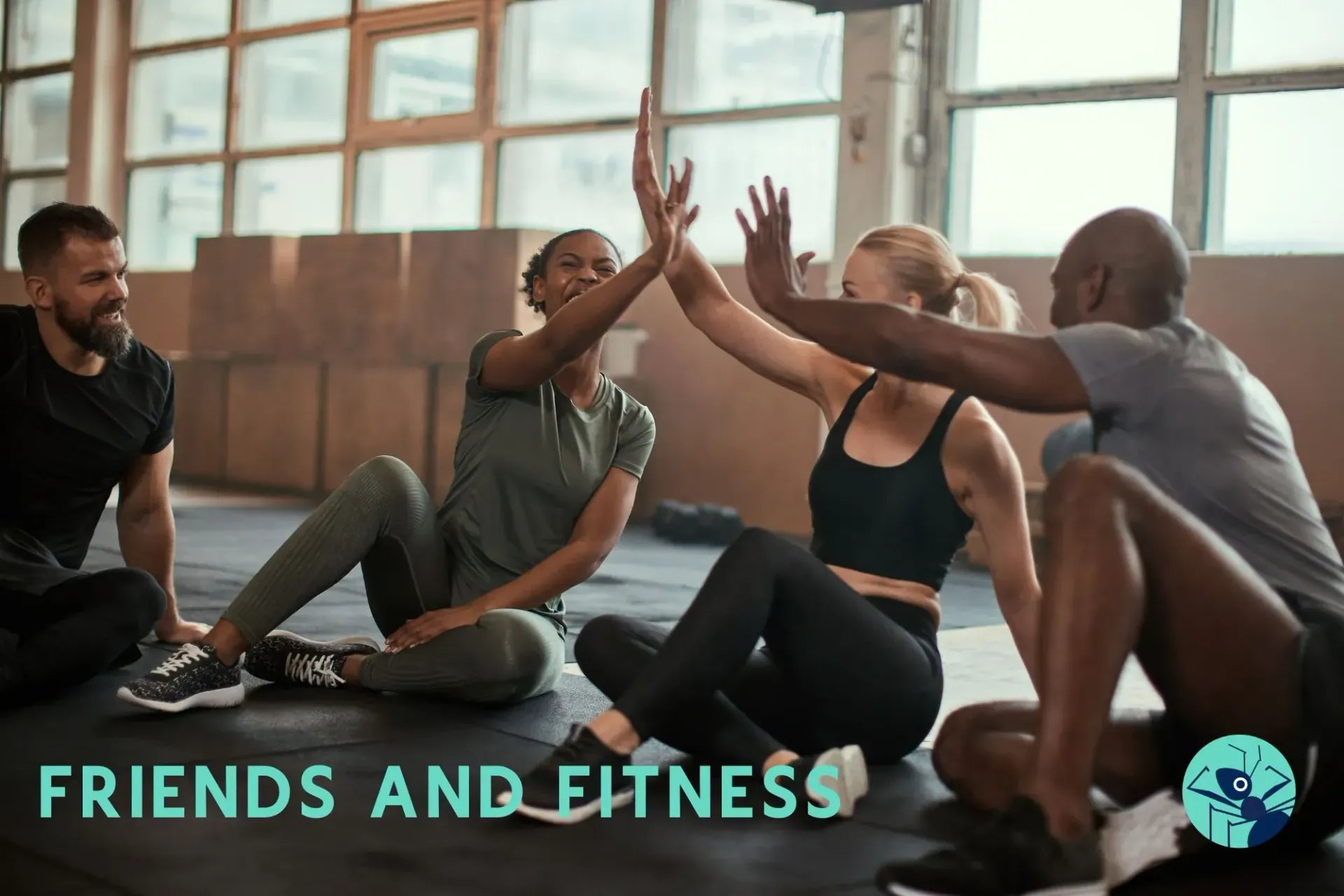 A group of people are giving each other a high five in a gym.