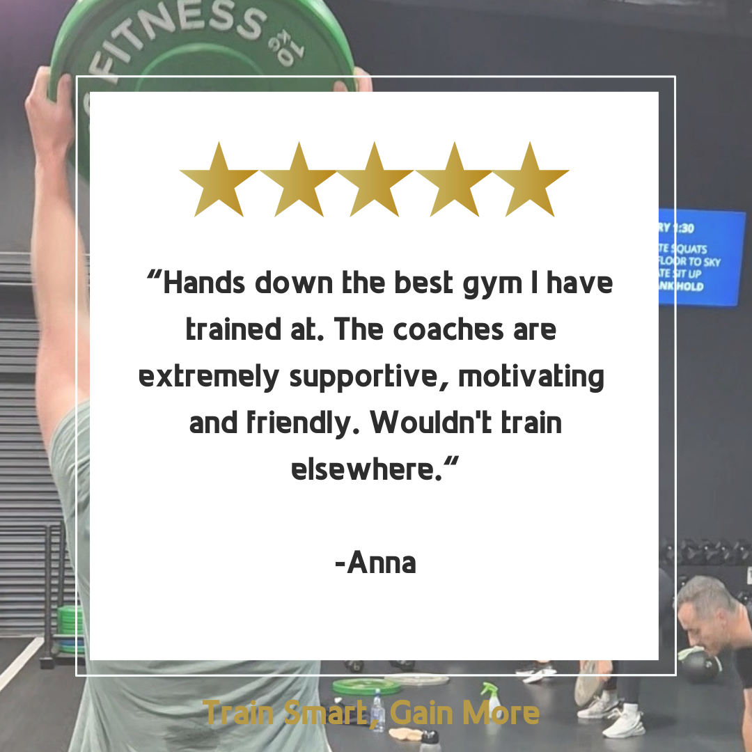 A man is lifting a barbell in a gym with a review from anna