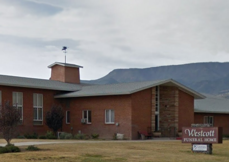 a large brick building with a sign that says westcott funeral home