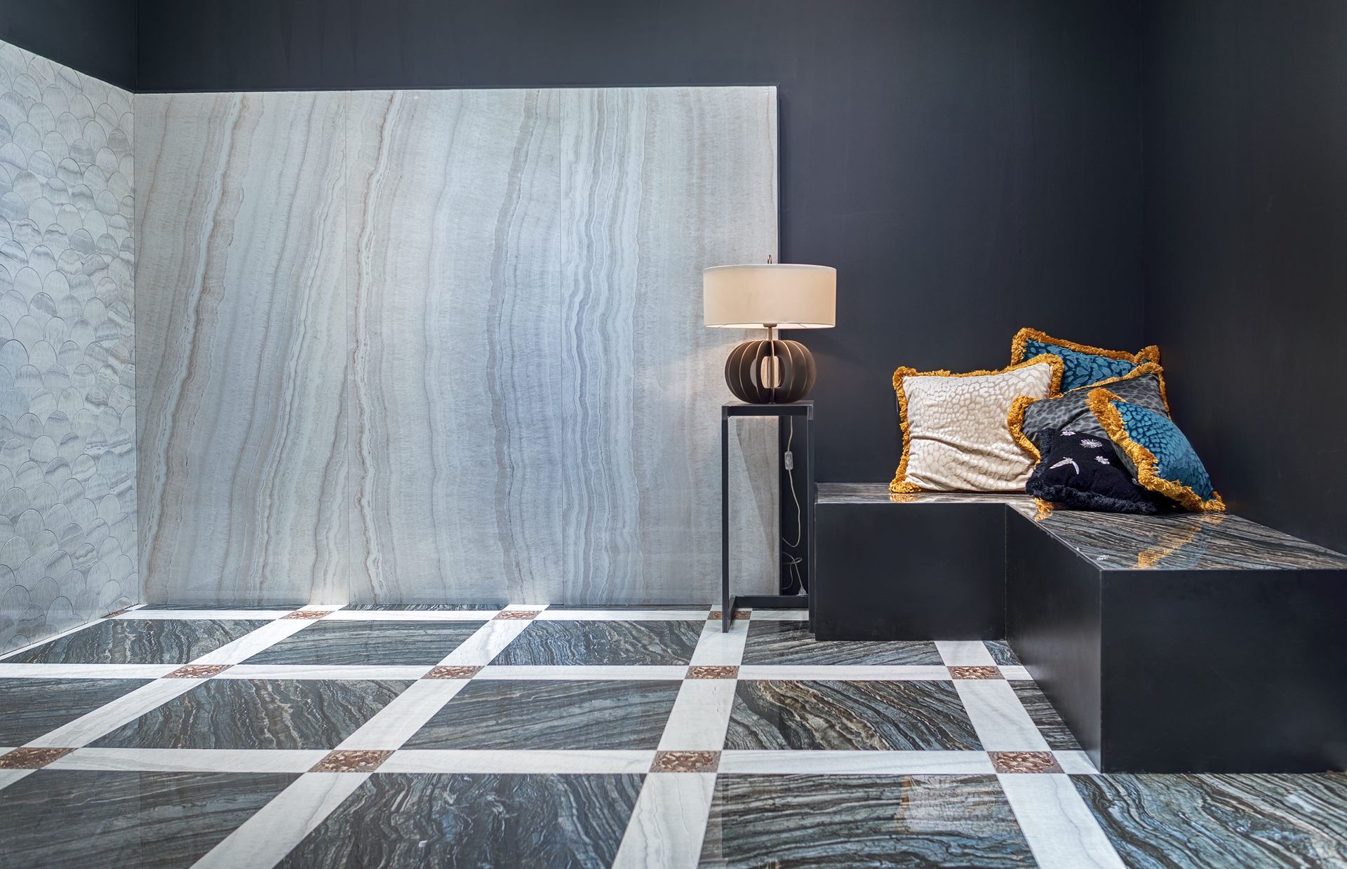 a living room with a marble floor and a lamp