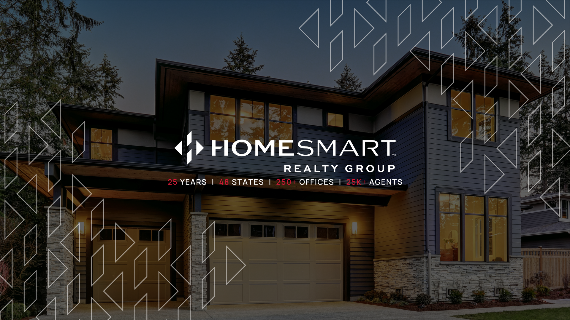 HomeSmart Realty Group sign over a modern house exterior at dusk