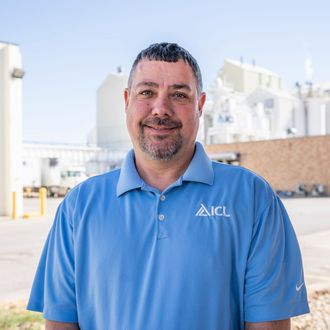 ICL employee smiles for the camera.
