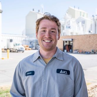 ICL employee smiles for the camera.