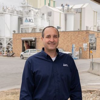 ICL employee smiles for the camera.