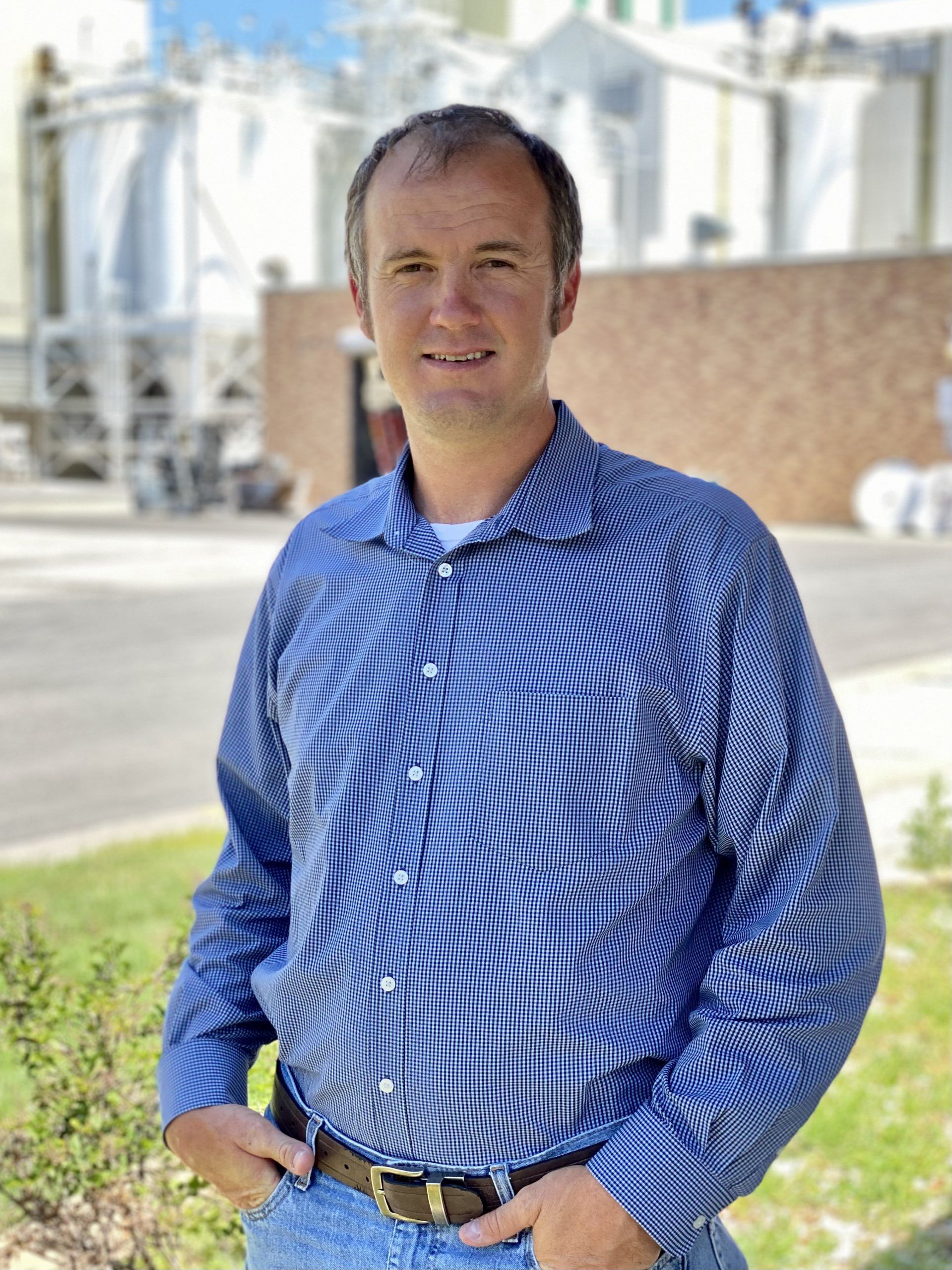 Jason stands and smiles for the camera for ICL.