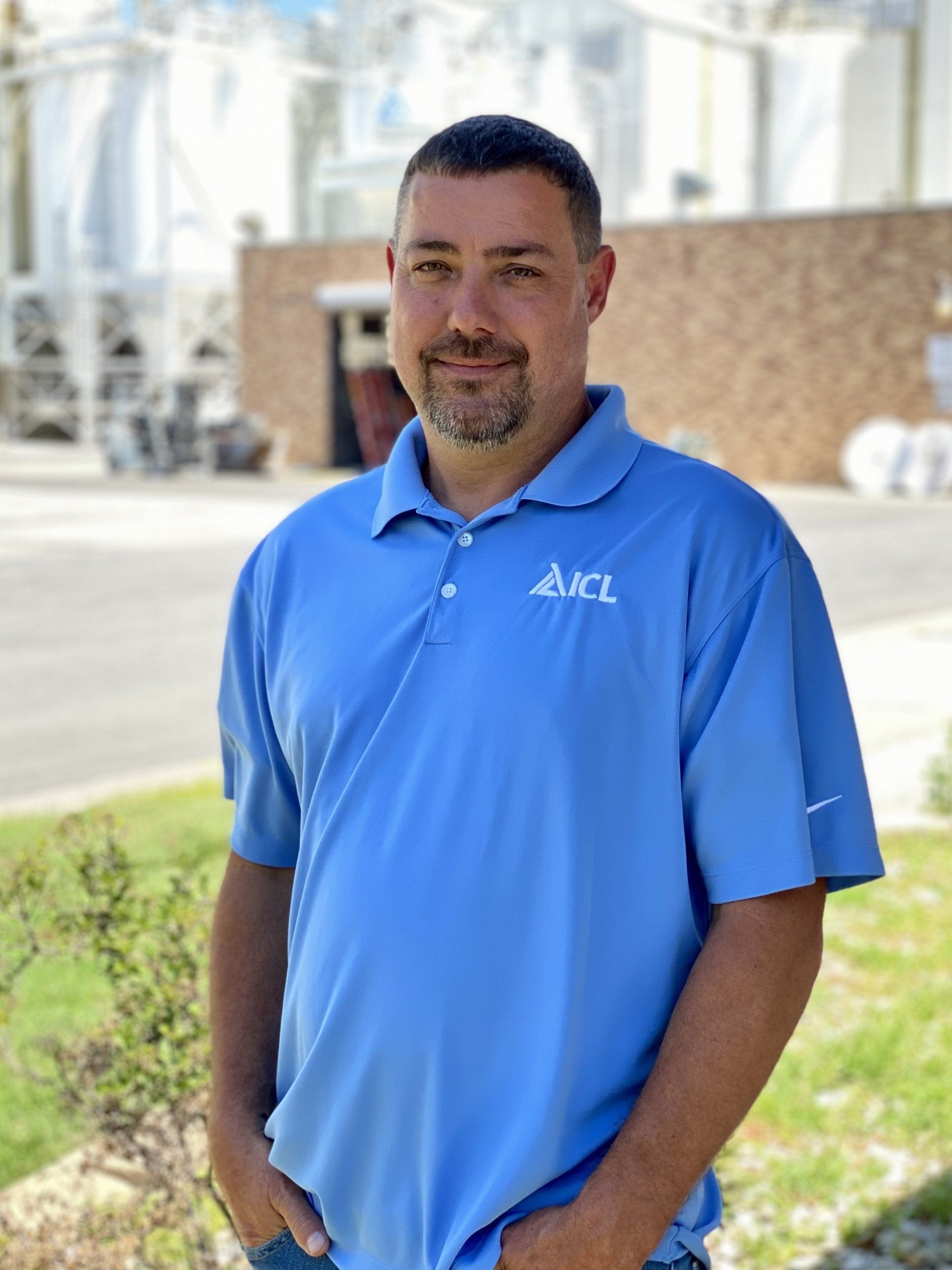 ICL employee smiles for the camera.