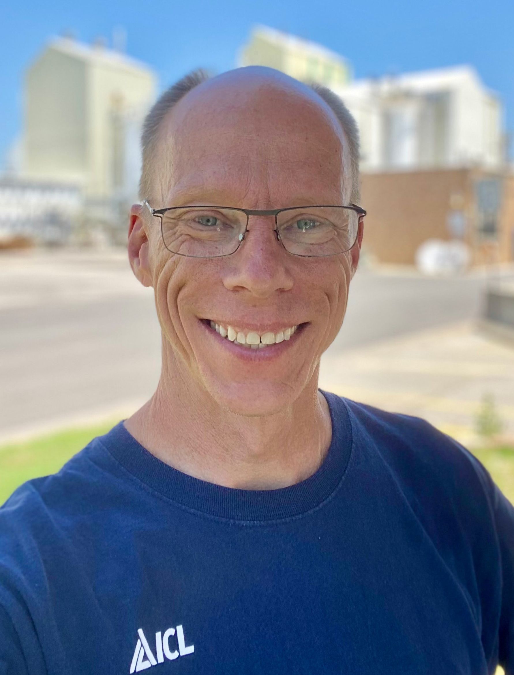 ICL employee smiles for the camera.
