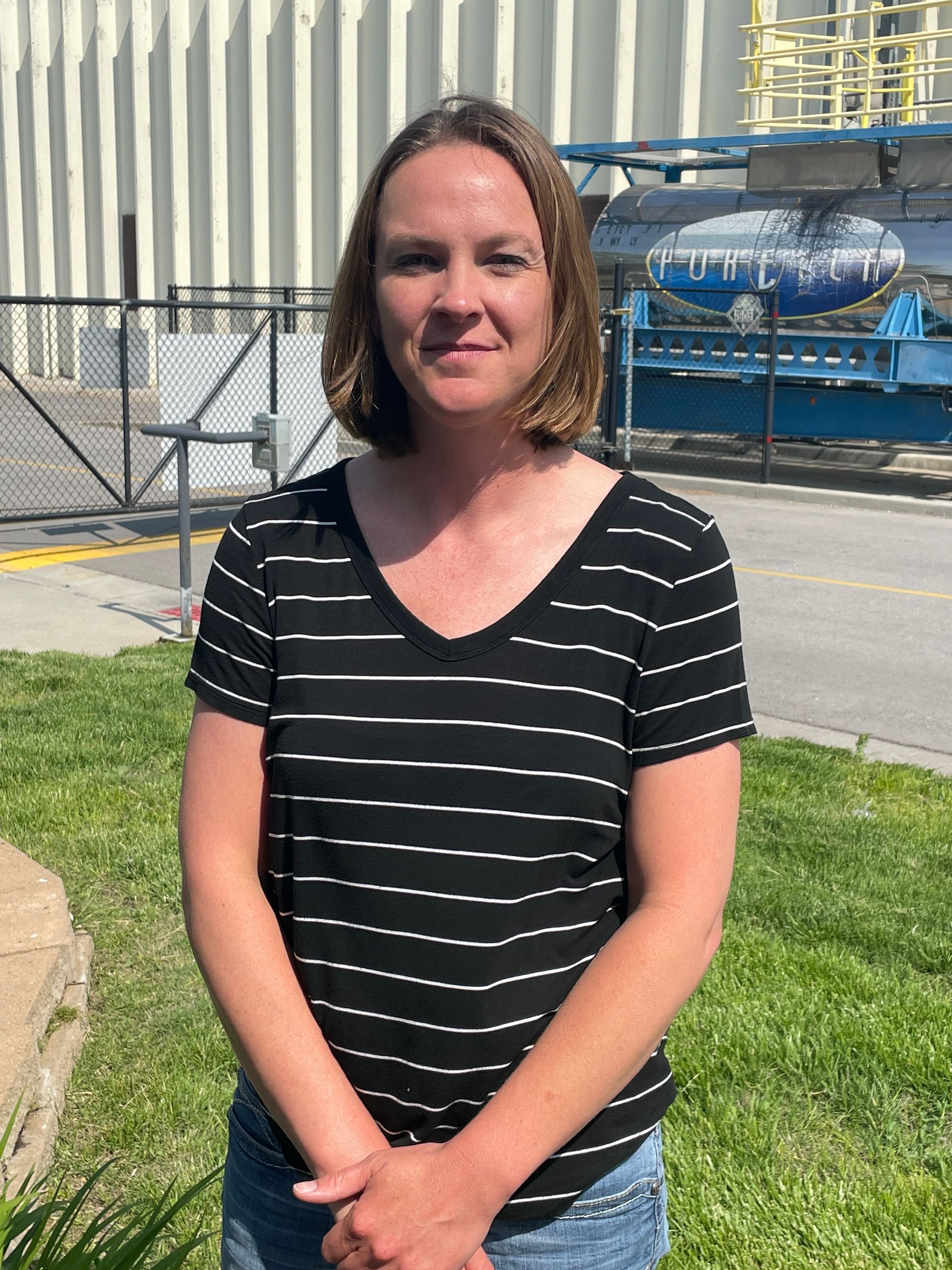 ICL employee smiles for the camera.