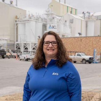 ICL employee smiles for the camera.
