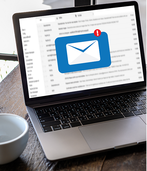 Laptop displaying an email inbox with an unread message notification.