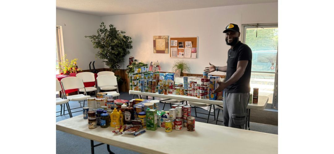 Pastor Kj Walker with VBS food donation