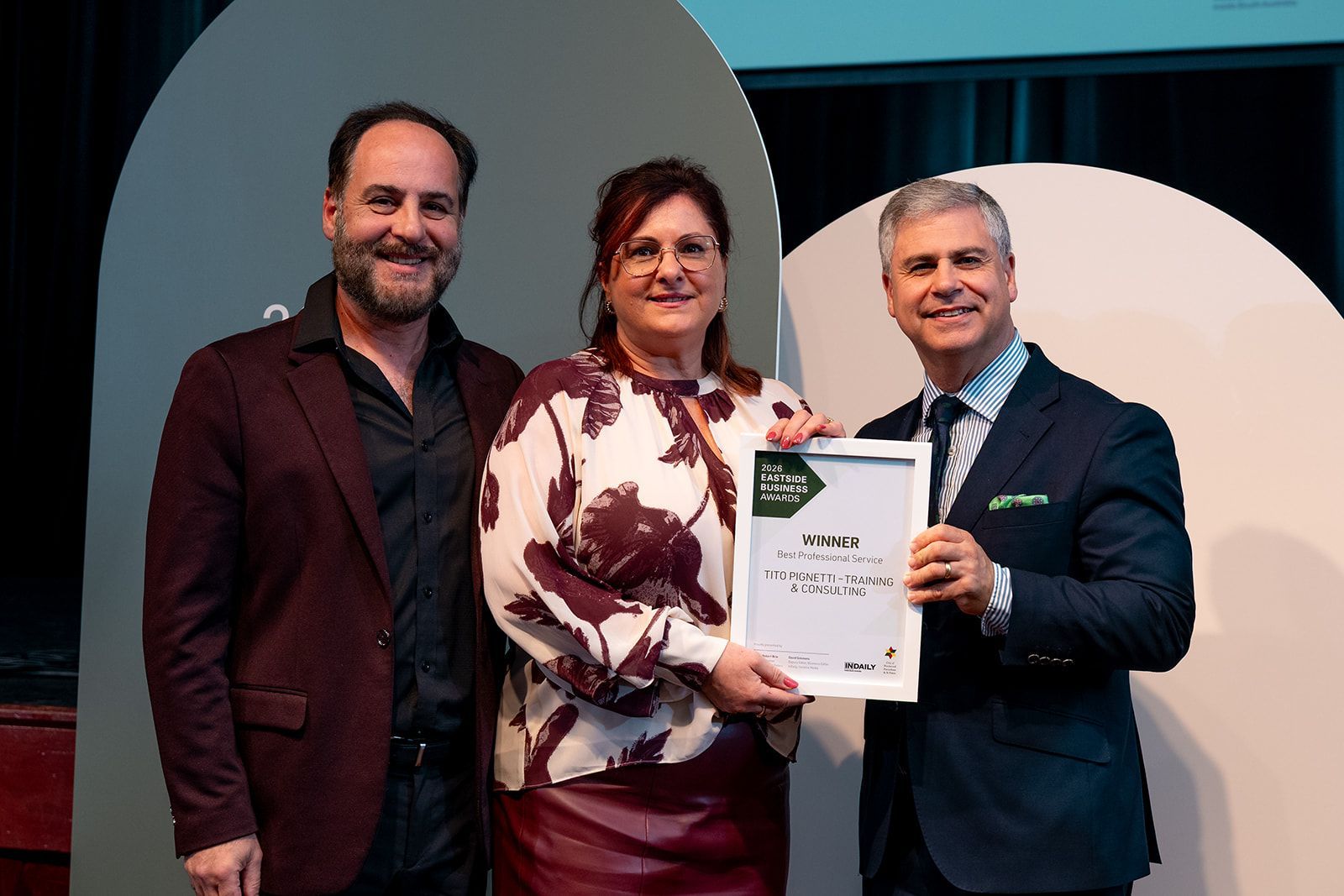 Tito and Anna Pignetti receiving awards from Mayor, Robert Bria, for Eastside Business Awards 2026