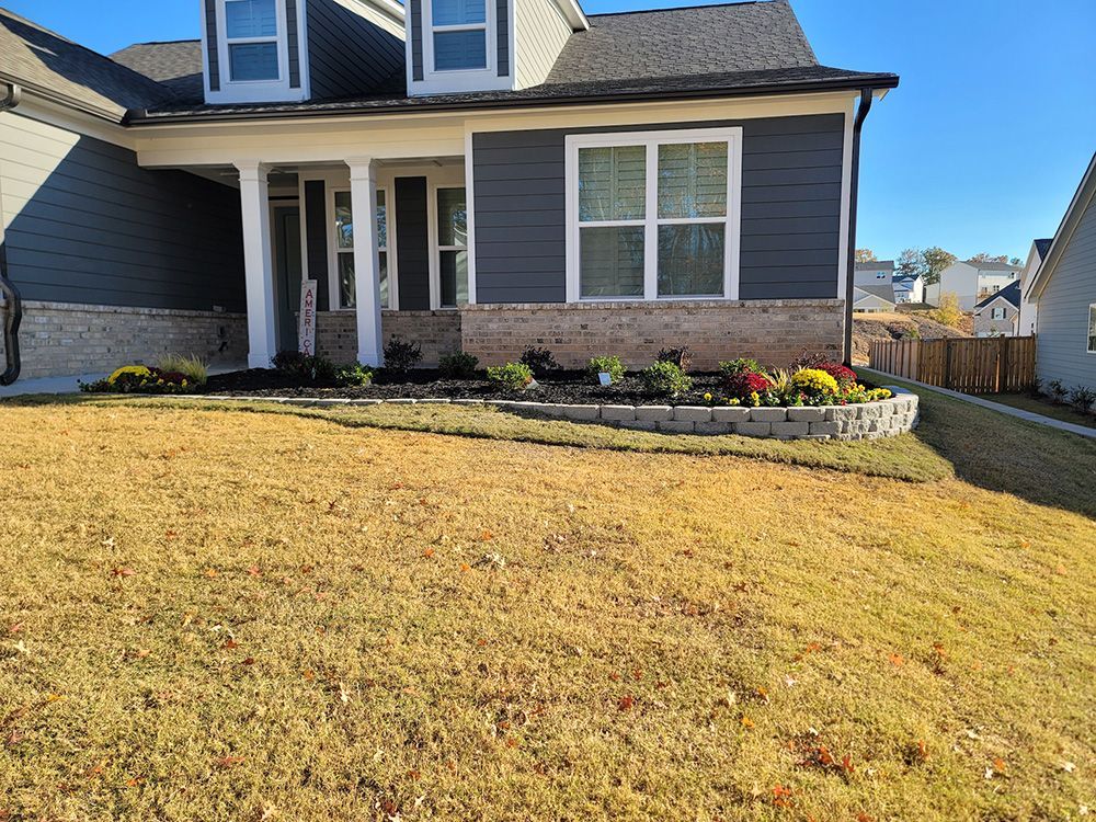 A large house with a large lawn in front of it