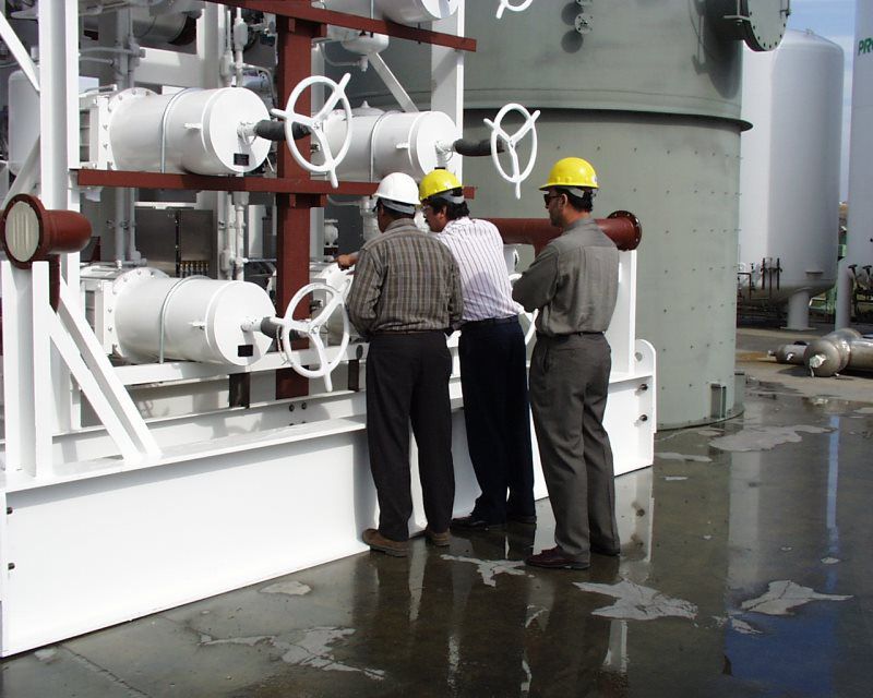 Engineers Checking the LNG Tank Pipes and Valve