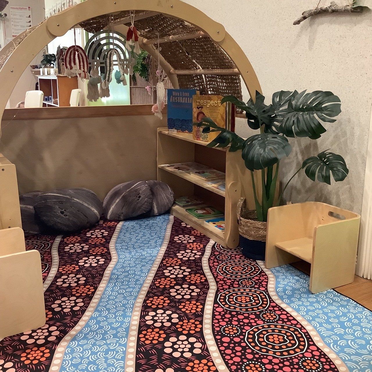 A Children's Room With A Bookshelf And A Rug — Juniors At Wamberal in Wamberal, NSW